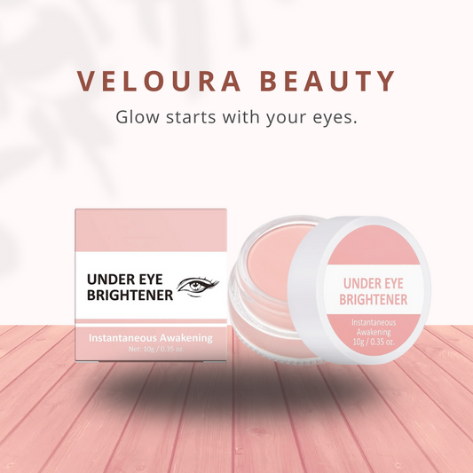 Veloura Beauty under eye brightener with packaging on a wooden surface